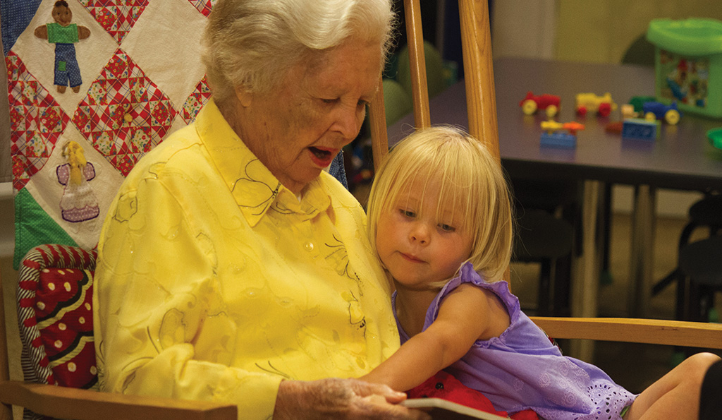 Senior Reading to a Child at Westminster Canterbury Richmond in Richmond, VA